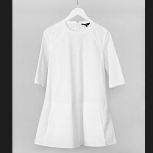 White Poplin party dress with pockets.